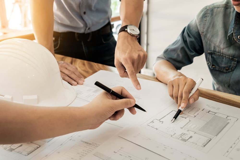 PRINCIPAL DESIGNER DISCUSSING PLANS